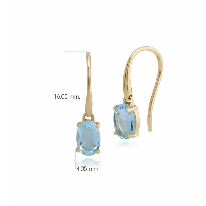 Aretes colgantes clásicos con topacio azul ovalado en oro amarillo de 9 quilates