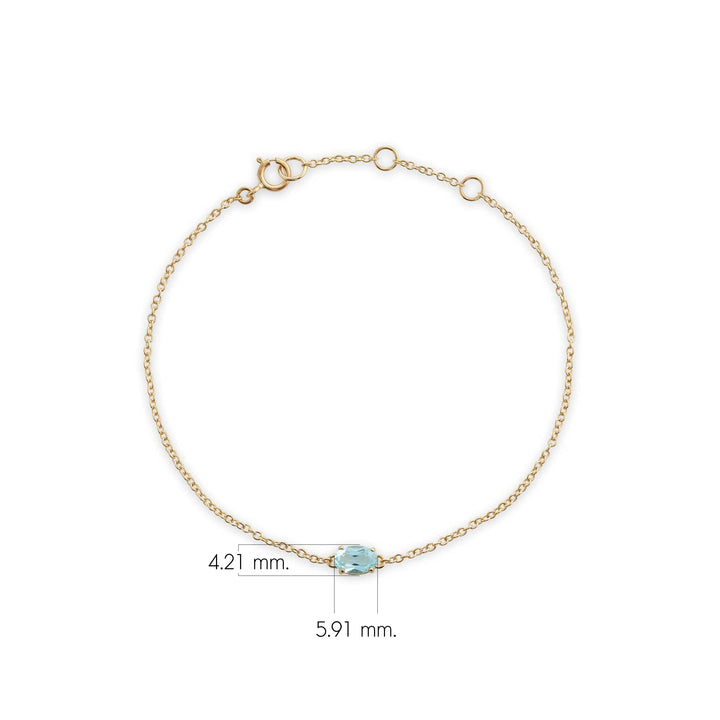 Brazalete clásico de topacio azul ovalado con una sola piedra en oro amarillo de 9 quilates