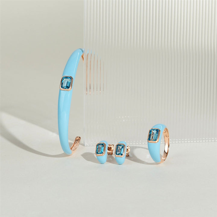 Pendientes de medio aro con esmalte azul y topacio azul cielo octagonal de Vals Siberiano en oro vermeil rosa