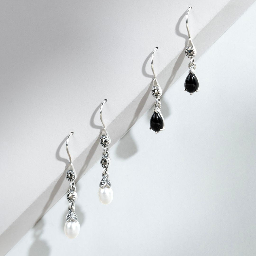Aretes colgantes estilo Art Nouveau con pera, ónix negro y marcasita en plata de ley 925