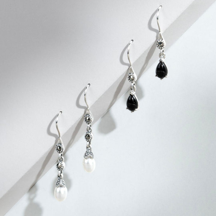 Aretes colgantes estilo Art Nouveau con pera, ónix negro y marcasita en plata de ley 925