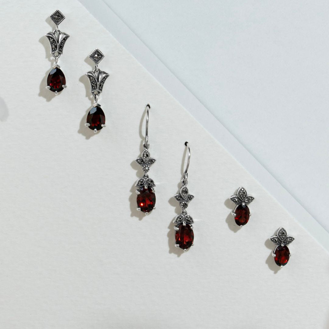 Aretes colgantes estilo Art Nouveau con granate ovalado y marcasita en plata de ley 925