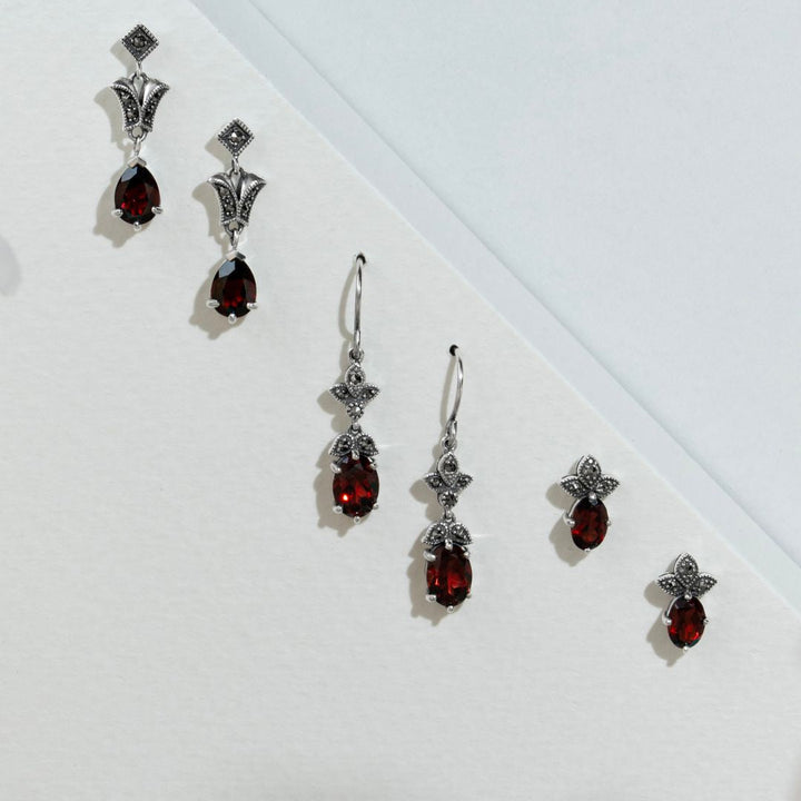 Aretes colgantes estilo Art Nouveau con granate ovalado y marcasita en plata de ley 925