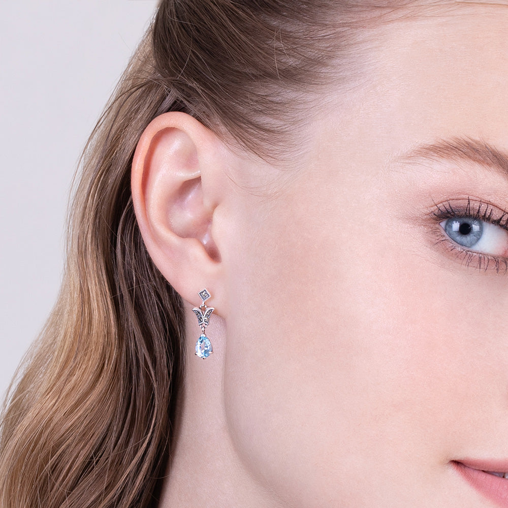 Aretes colgantes estilo Art Nouveau con topacio azul pera y marcasita en plata de ley 925