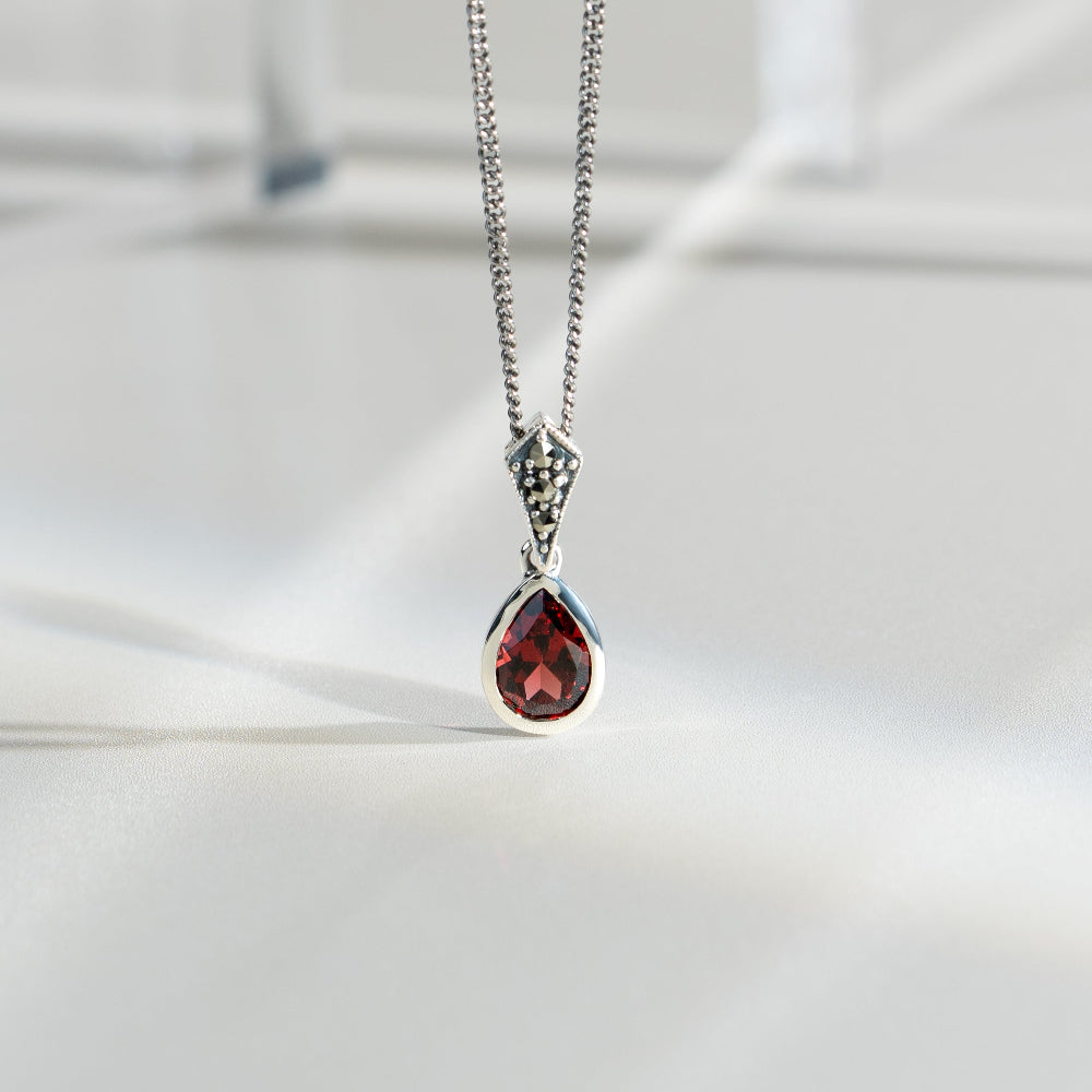 Art Deco Style Oval Pear Garnet & Marcasite Pendant in 925 Sterling Silver flatlay