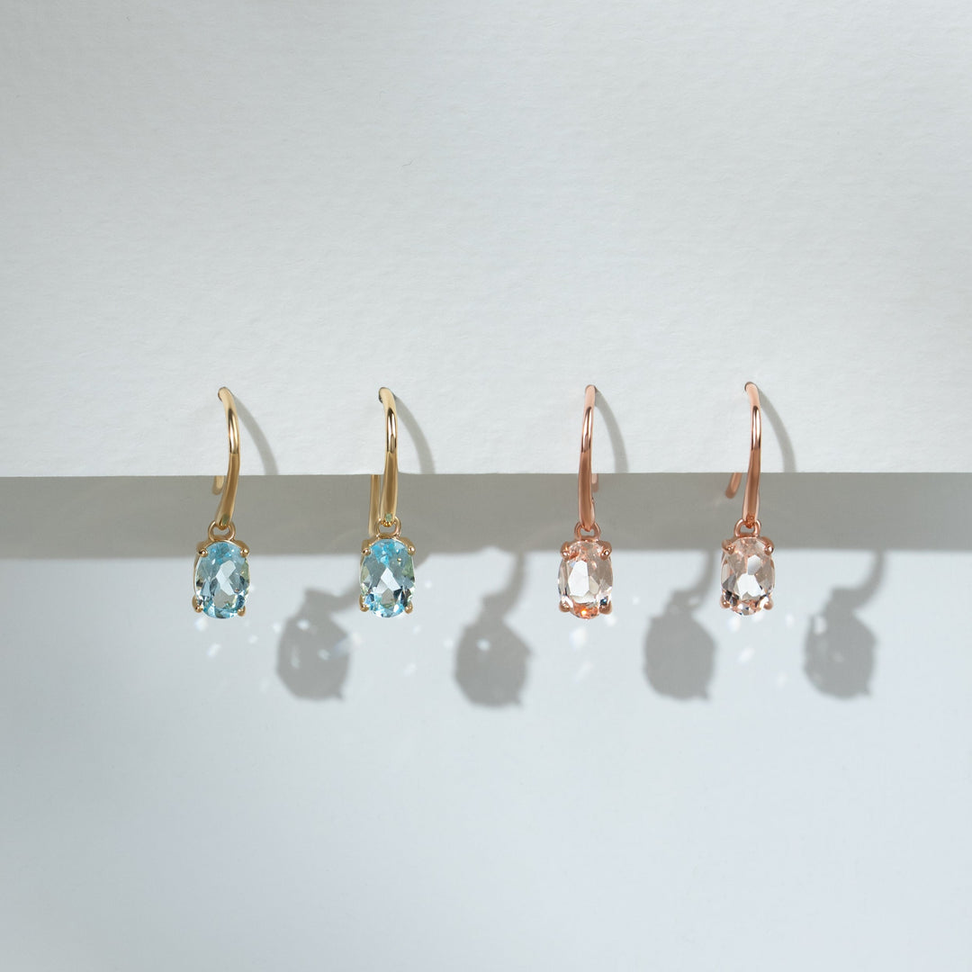 Aretes colgantes con aguamarina ovalada clásica en oro amarillo de 9 quilates