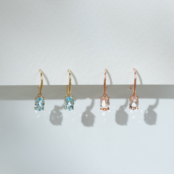 Aretes colgantes con aguamarina ovalada clásica en oro amarillo de 9 quilates