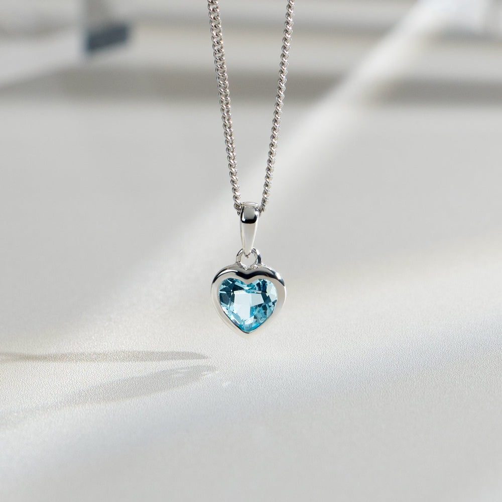 Essential Heart Shaped Blue Topaz Pendant in 925 Sterling Silver flatlay