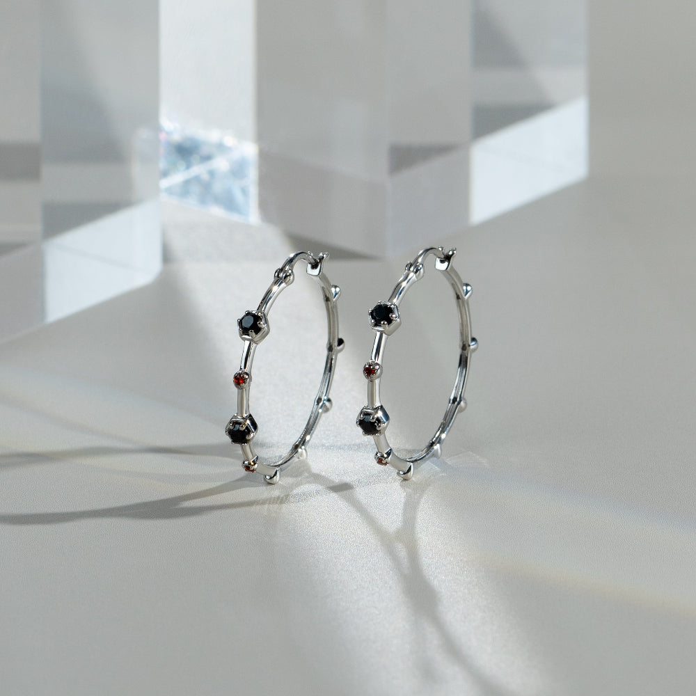 Modern Glam Spinel & Garnet Hoop Earrings In Sterling Silver flatlay